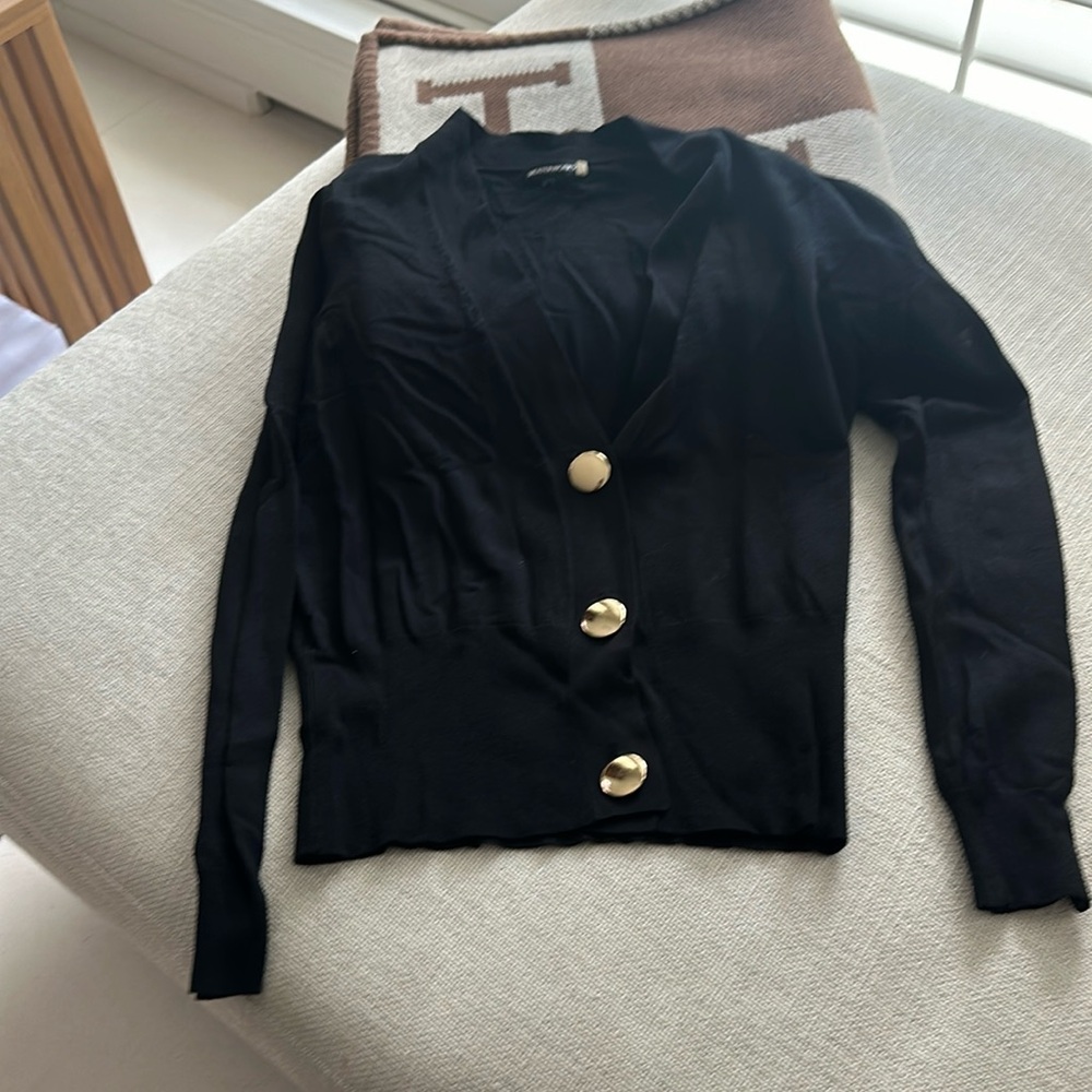 Beautiful large button cardigan.  Stretchy.